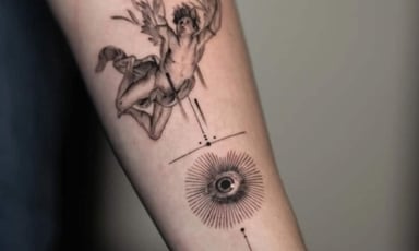 Tattoo of a flying figure with an eye motif on arm
