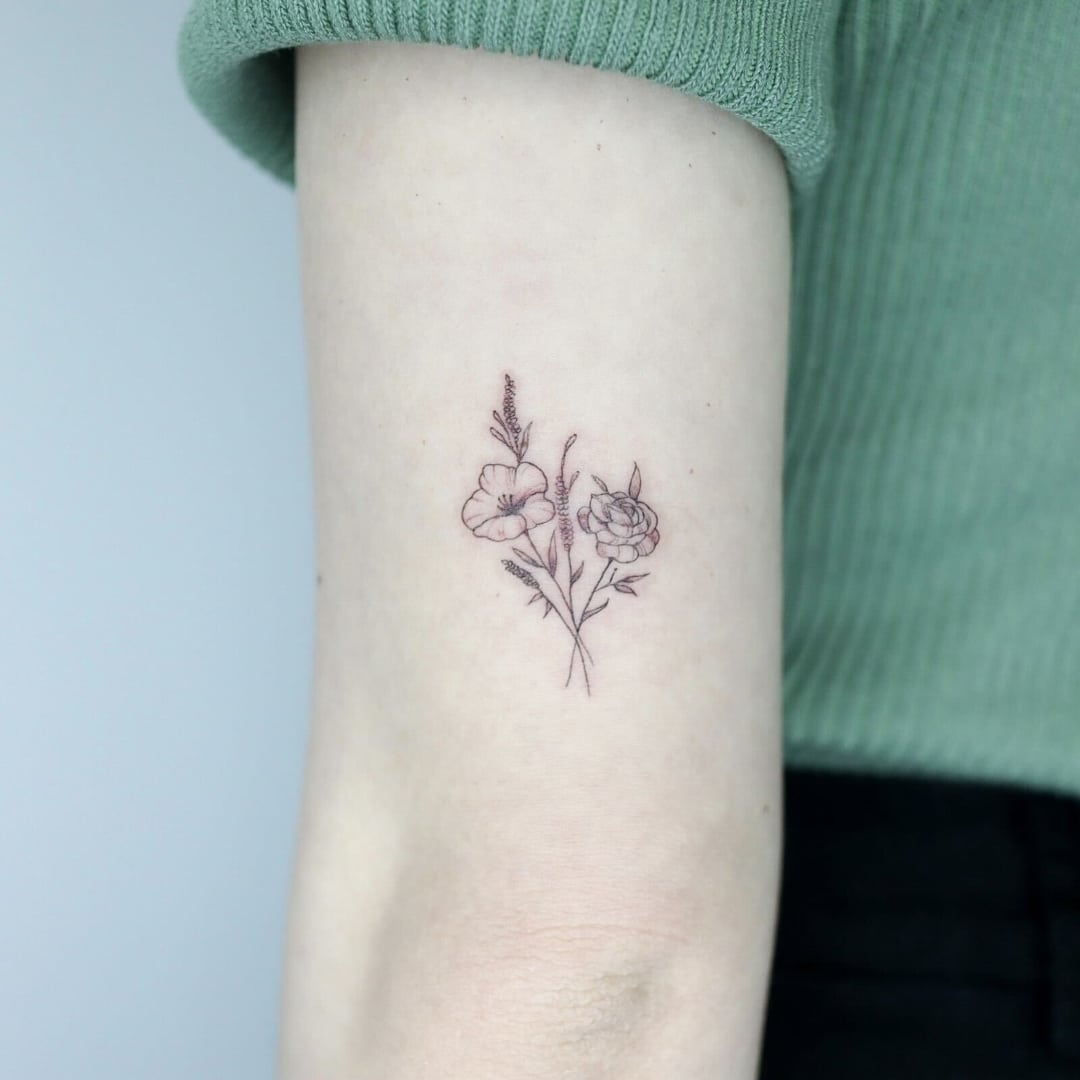Delicate floral tattoo on an arm