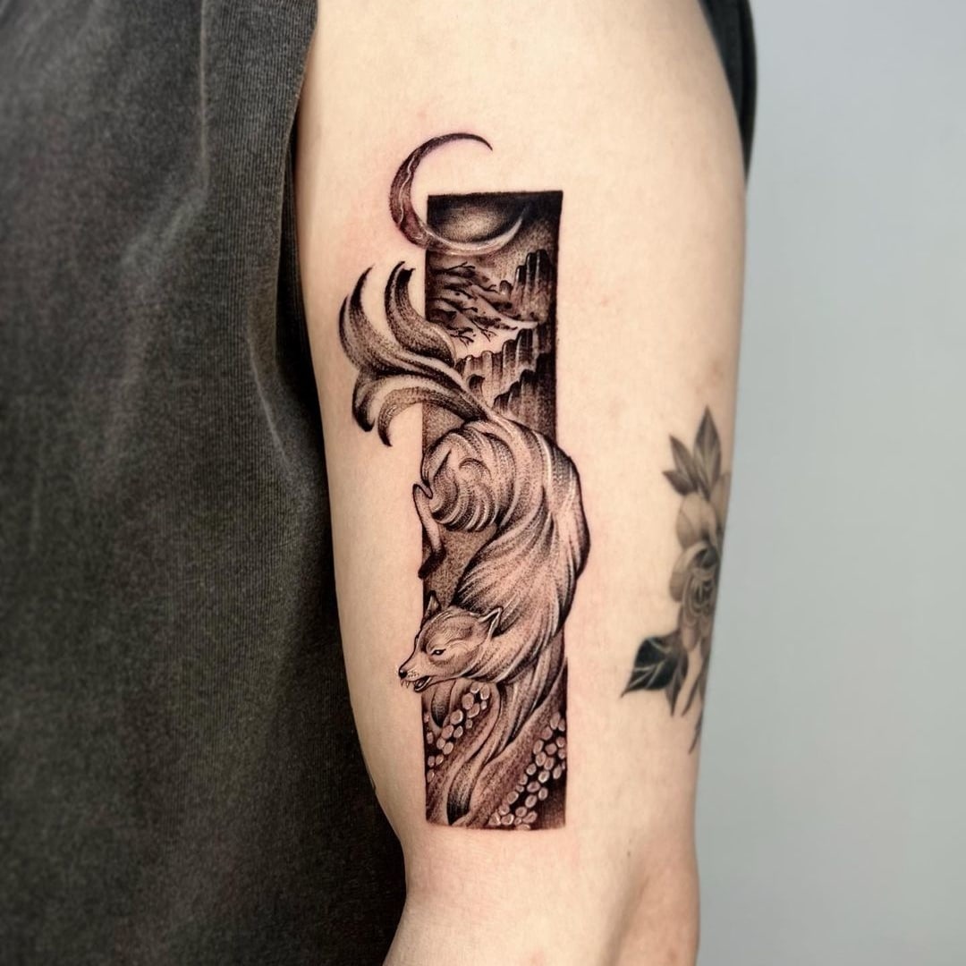 Tattoo of a fox with swirling fur and a crescent moon