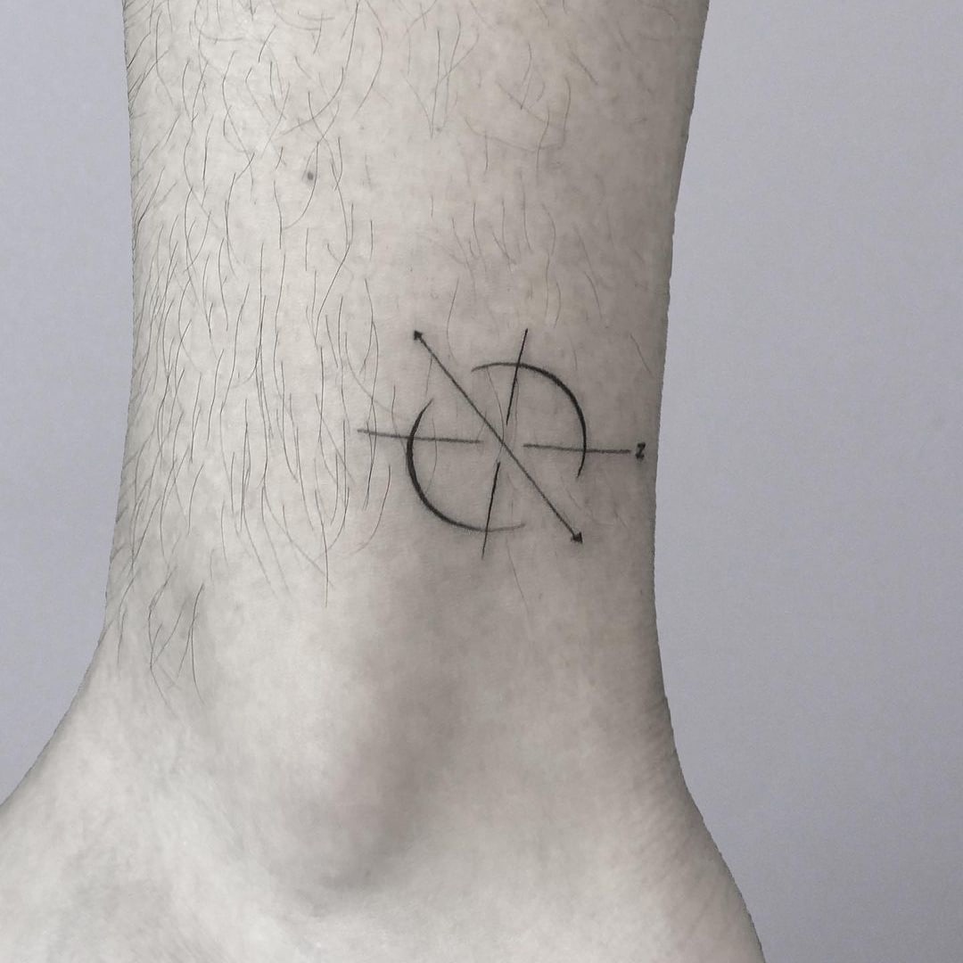 Minimalist tattoo design on ankle with geometric elements