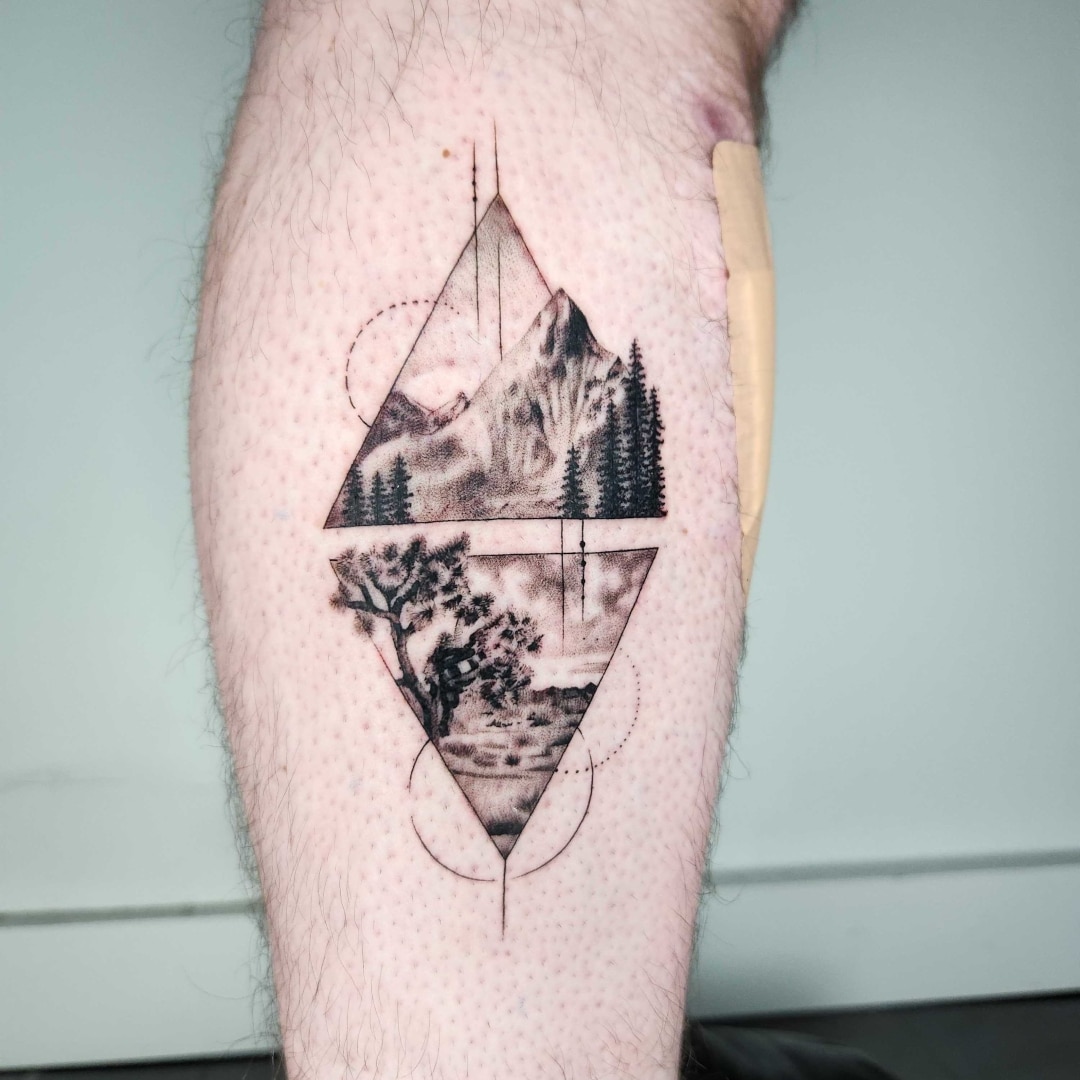 Stylish tattoo design featuring mountains and trees