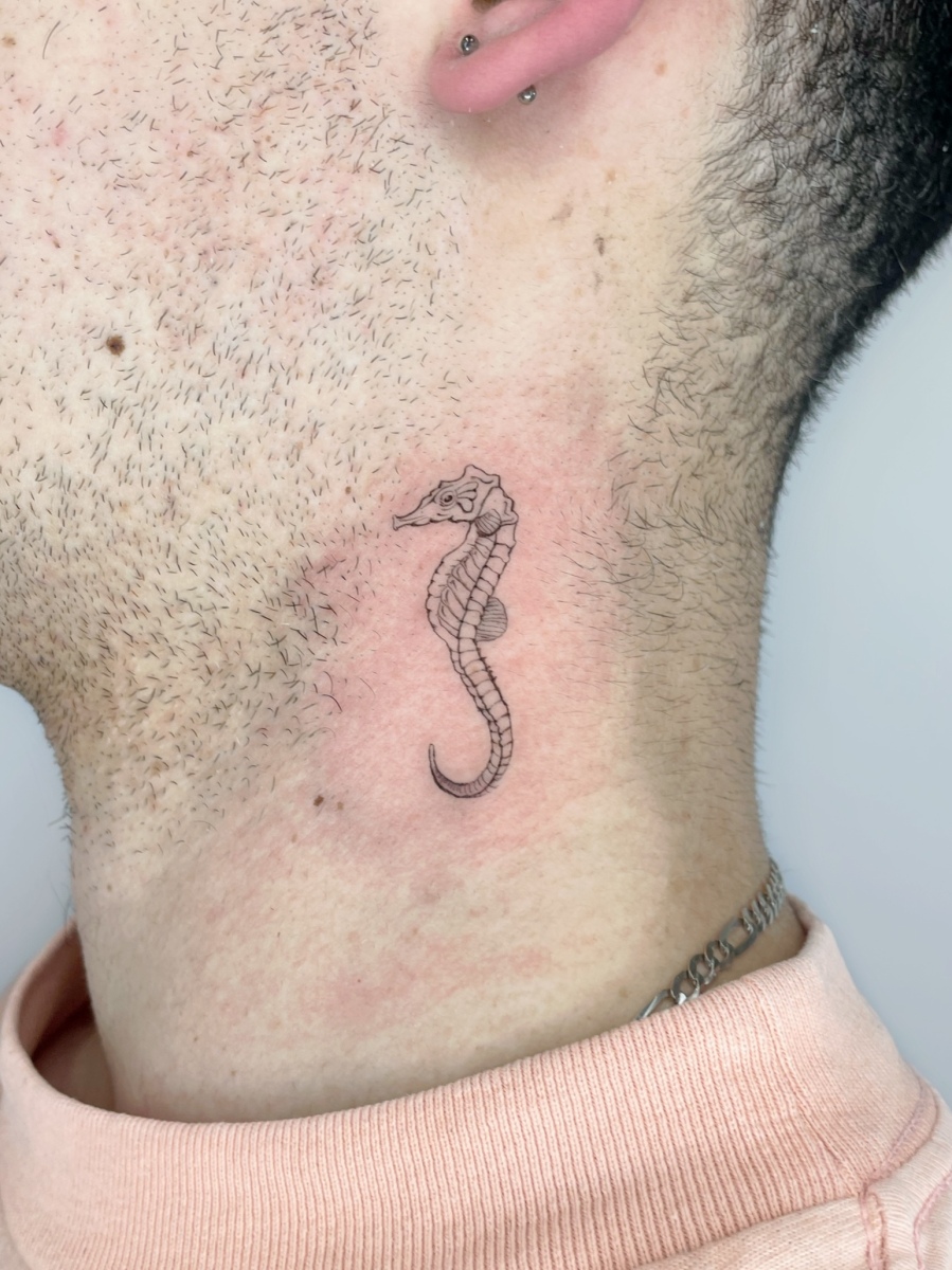 Seahorse tattoo on neck
