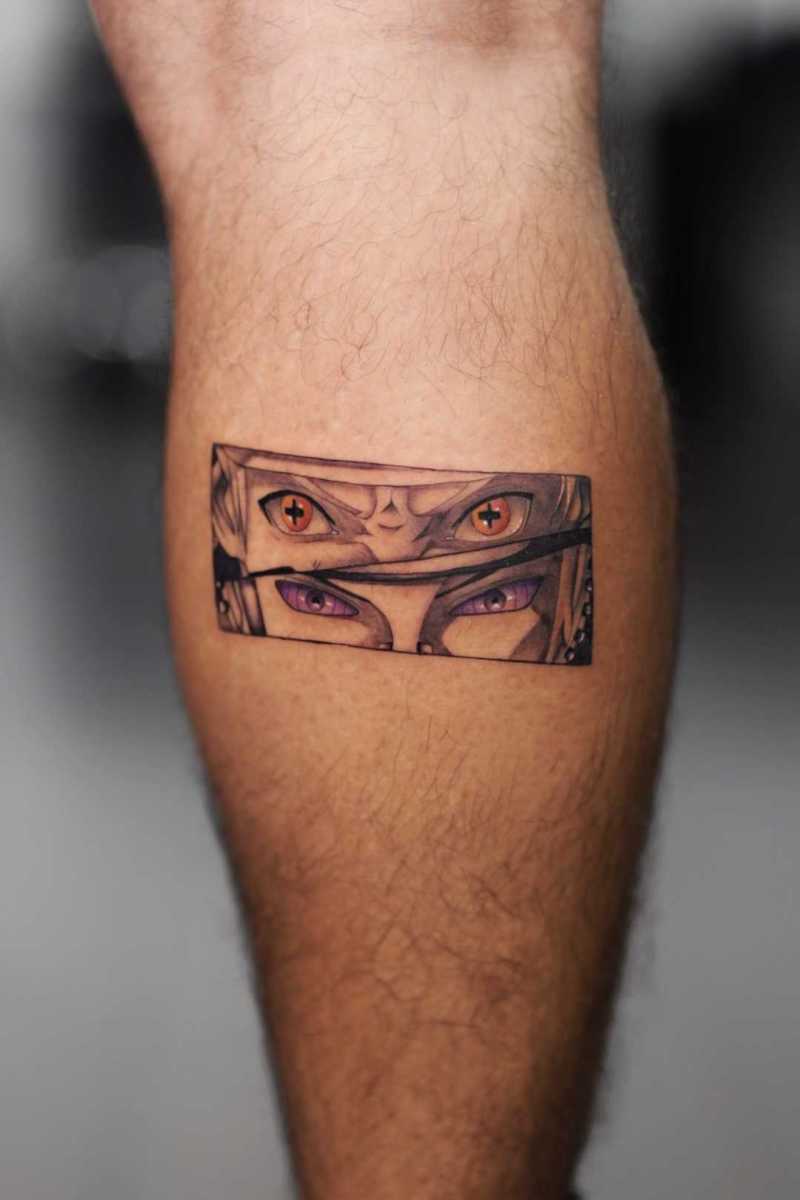 Close-up of a tattoo featuring two sets of eyes
